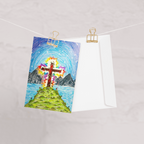 Colourful drawing of a cross on a mountain with a white envelope underneath, pinned to a string.