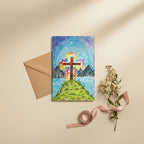 Colourful drawing of a cross on a mountain with a white envelope underneath, pinned to a string.
