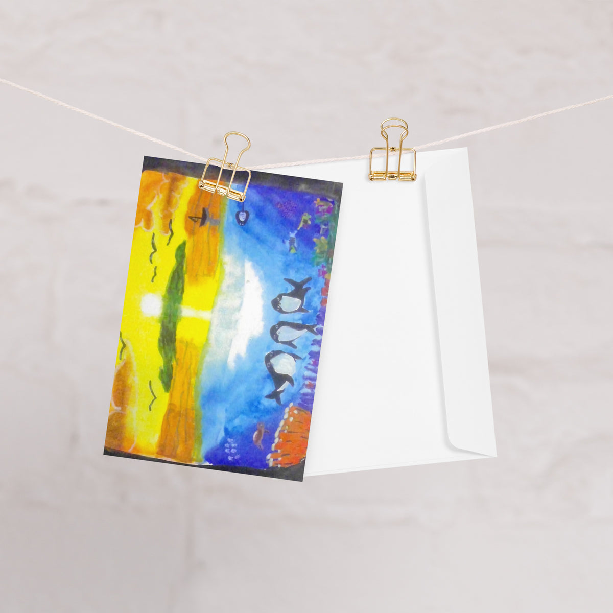 Dolfriends 4x6 greeting card featuring three dolphin friends in a colourful ocean with a sunset in the distance – AllThingsGoode