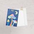 Glowing Mushrooms 4x6 greeting card featuring 3 glowing mushrooms with a rainy midnight background and moon – AllThingsGoode