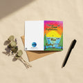 A greeting card with a sunrise design and text that says, "The sun of righteousness will rise with healing in its rays." -Malachi 4:2.