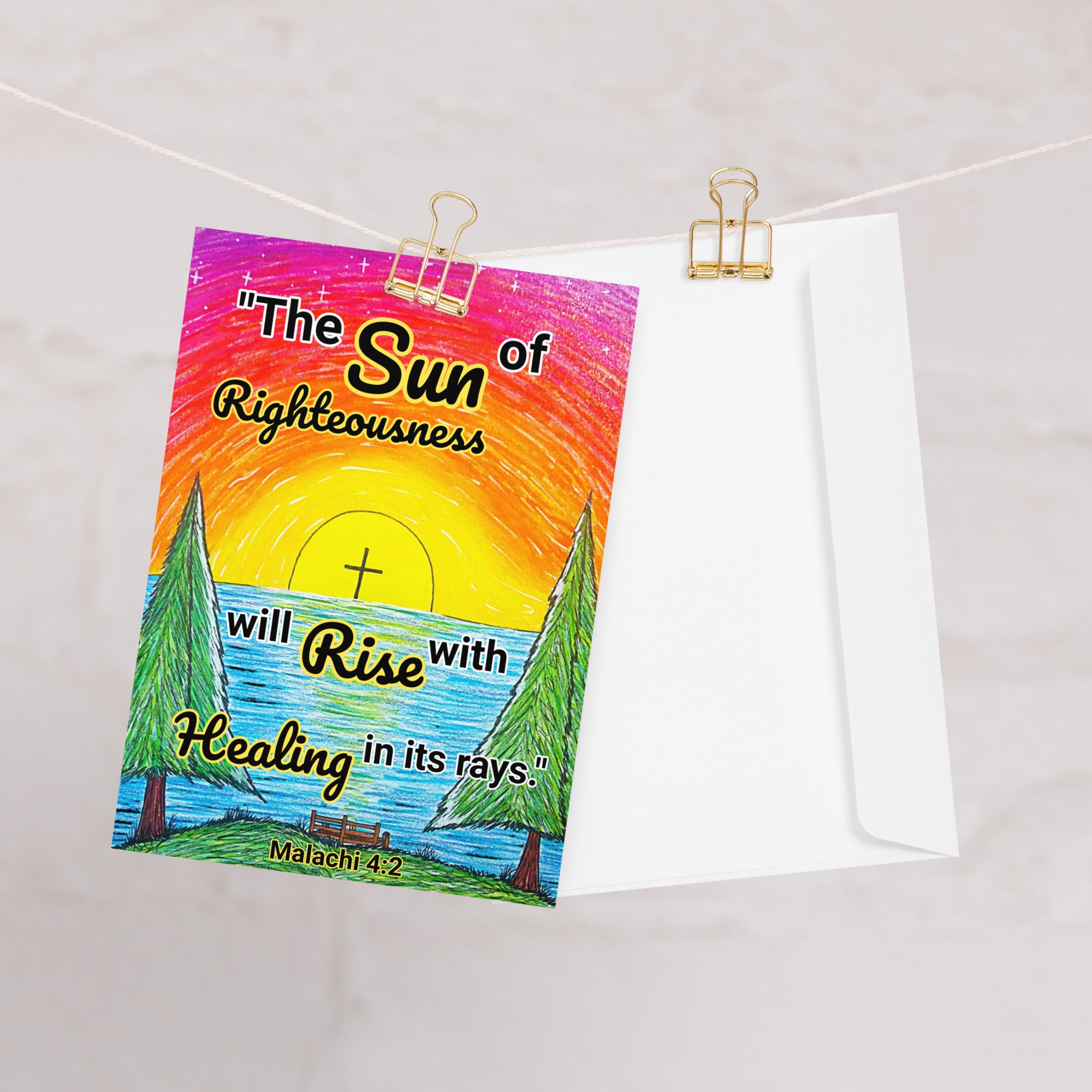 A greeting card with a sunrise design and text that says, "The sun of righteousness will rise with healing in its rays." -Malachi 4:2.