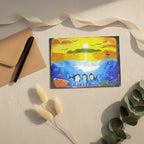 Dolfriends 5x7 greeting card featuring three dolphin friends in a colourful ocean with a sunset in the distance – AllThingsGoode