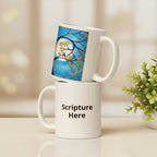 Two white mugs with one featuring a blue design and the other with 'Scripture Here' text.
