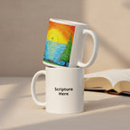 Two stacked white ceramic mugs on a tabletop. The top mug features a colorful hand-drawn sunset and sailboat illustration, while the bottom mug has the text 'Scripture Here' printed in black.