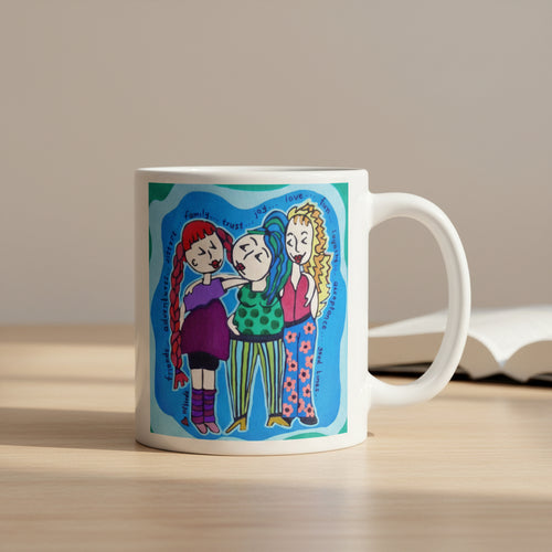 Mug with colorful illustration of three characters on a white background