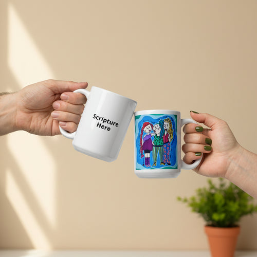 Two hands holding white ceramic mugs against a plain white background. The mug on the left is plain white with the black text 'Scripture Here,' and the mug on the right has a colorful cartoon-style illustration of three people with the text 'Believe in Me.